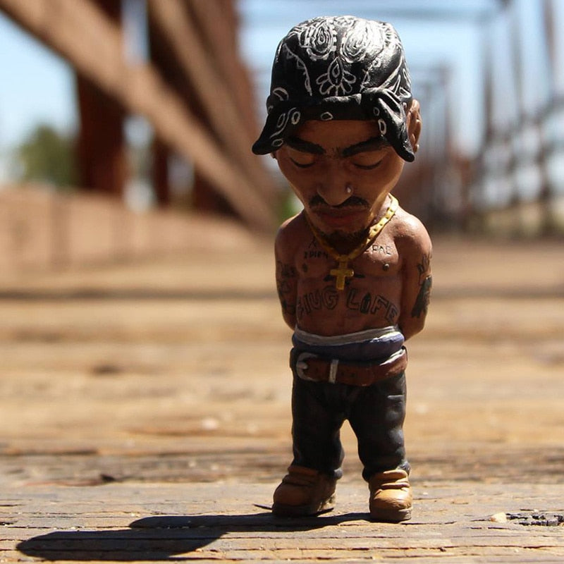 Tiny tributes to hip-hop history. Our miniature figure of 2Pac honors the pioneers of old-school rap. These sleek, iconic designs capture the essence of an era. Perfect for any music lover's display.