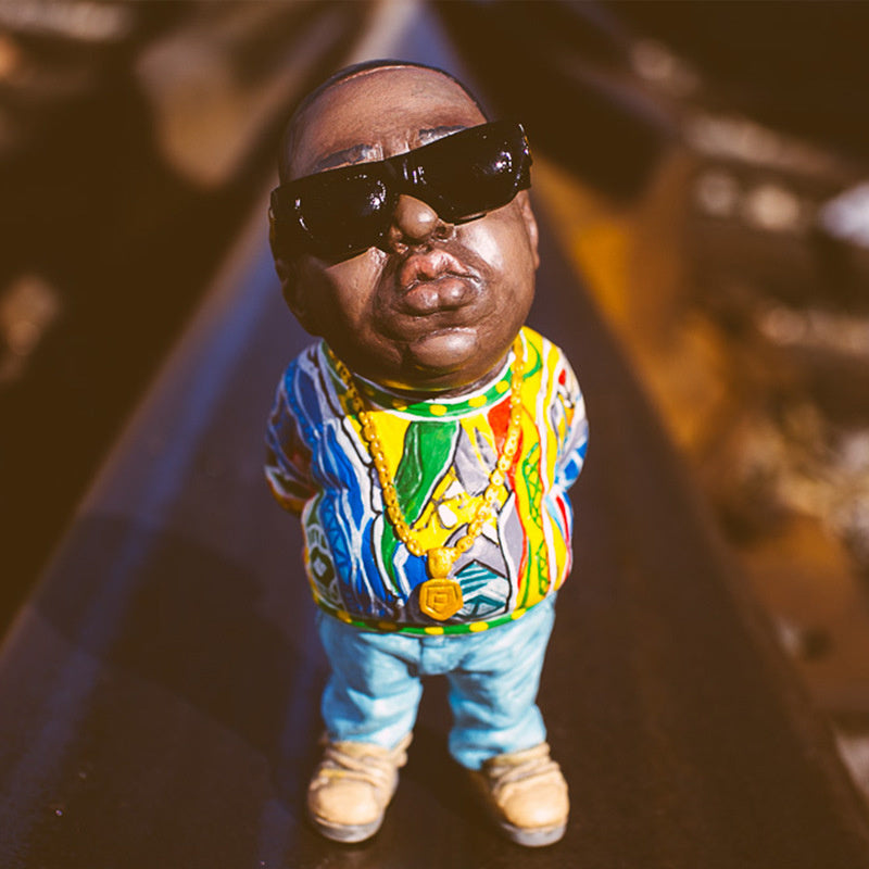 Tiny tributes to hip-hop history. Our miniature figure of The Notorious B.I.G. honors the pioneers of old-school rap. These sleek, iconic designs capture the essence of an era. Perfect for any music lover's display.